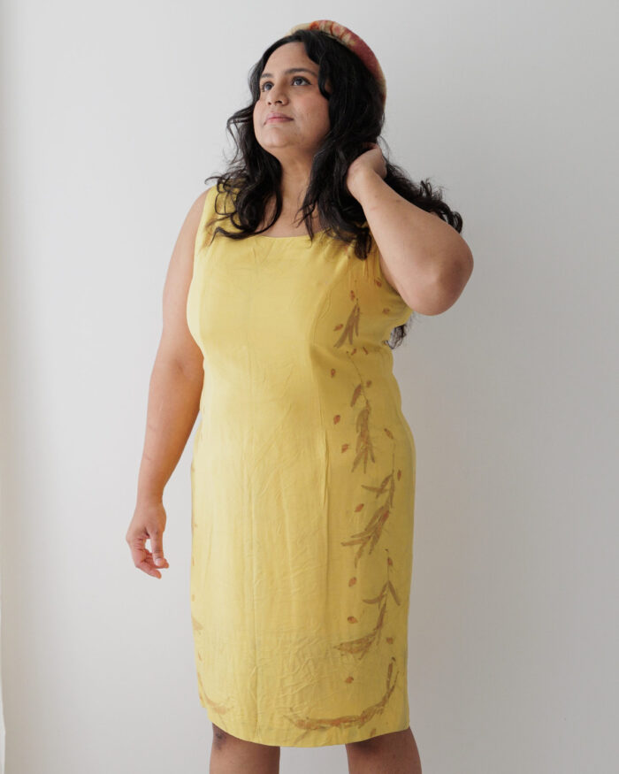 Yellow silk sleeveless dress eco printed with orange eucalyptus leaves