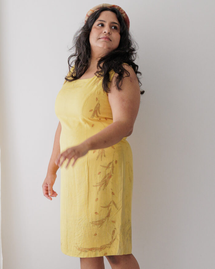 Yellow silk sleeveless dress eco printed with orange eucalyptus leaves