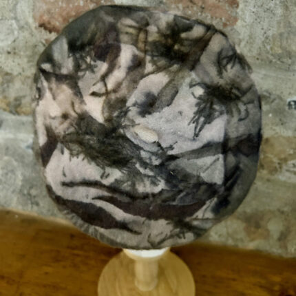 Pale pink wool beret eco printed with dark brown long ecucalyptus eaves and dark brown black spiky tamarisk leaves