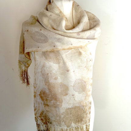 Cream pure silk damask long scarf with fine silk tassels has been eco printed with grey cotinus and brown sycamore prints and displayed on a white dress mannequin